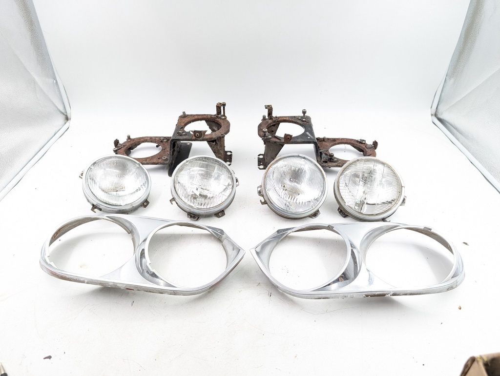 PAIR XJS TWIN HEADLIGHT MOUNTS AND SURROUND CHROME BEZELS LIGHT BRACKETS